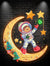 Astronauts on a golden Christmas-decorated moon: happy stargazing holiday miracle neon signs