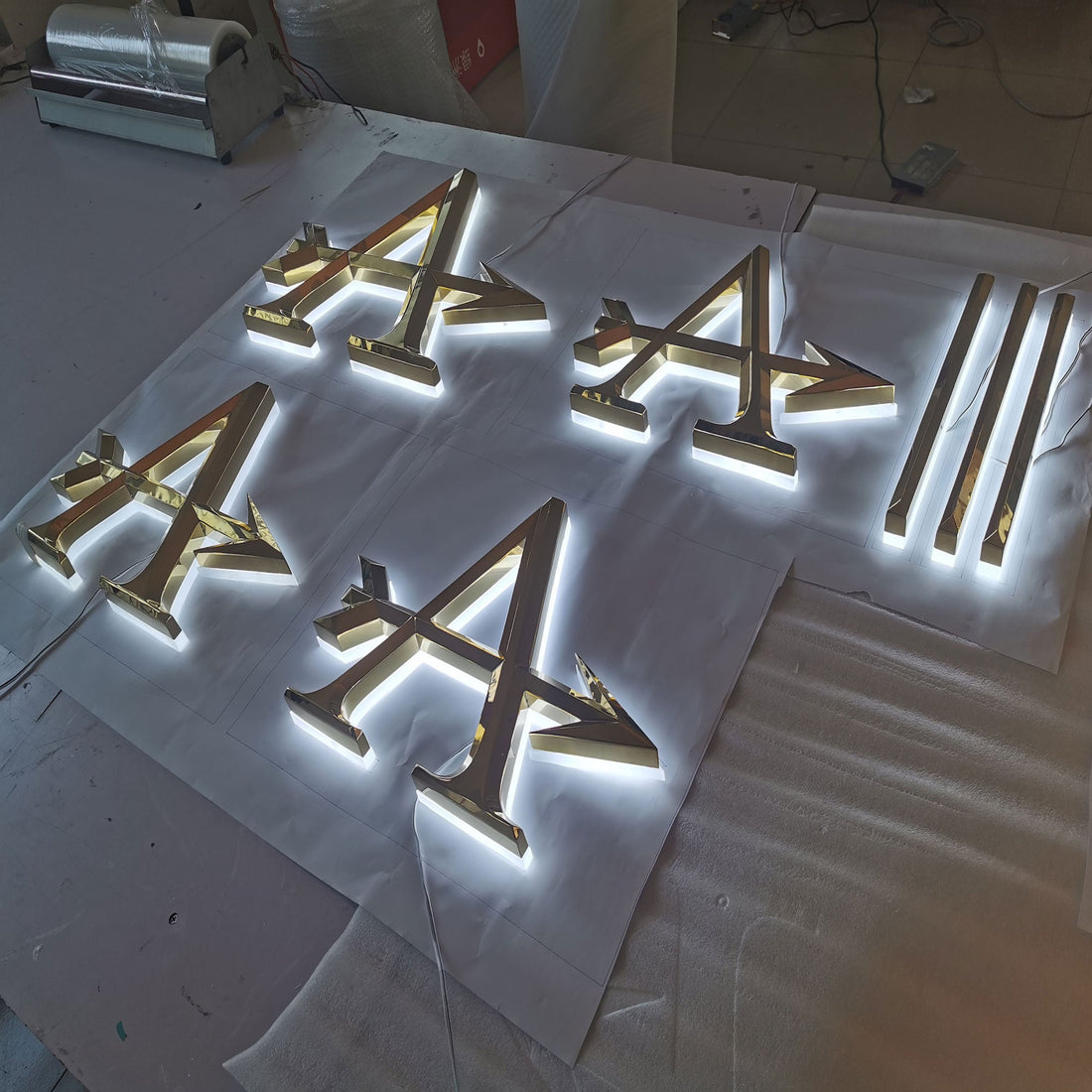 Wholesale factory supplies halo lit acrylic LED letters mirror finish golden stainless steel beveled face letter logo